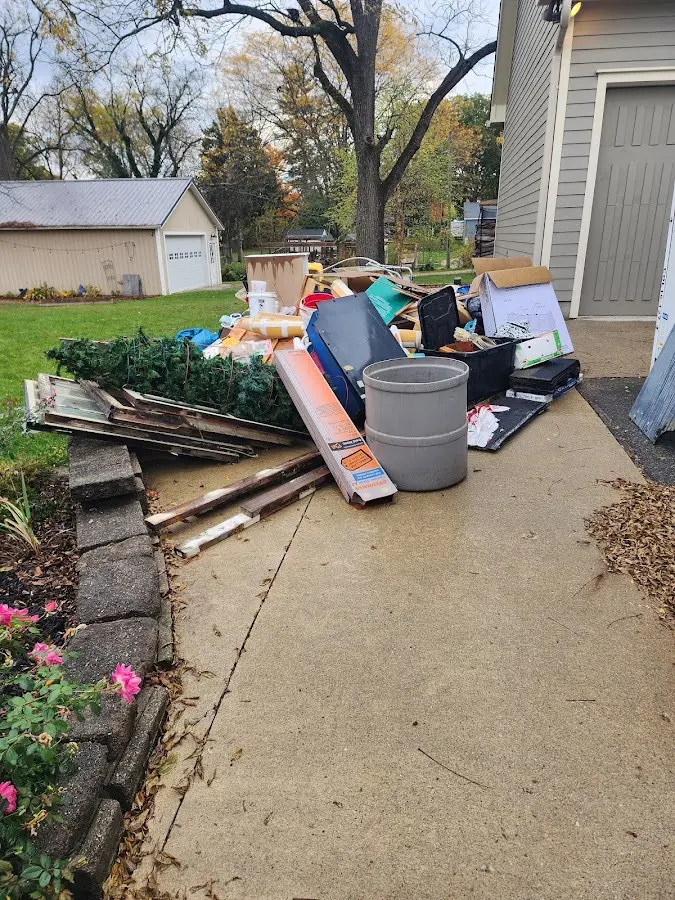 Dumpster being loaded with debris for Residential Dumpster Rental in Lawrenceburg
